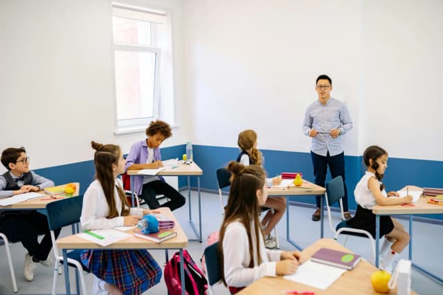 A school administrator in a classroom